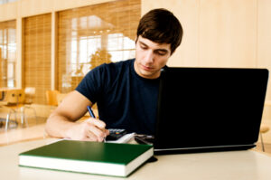 guy studying with computer